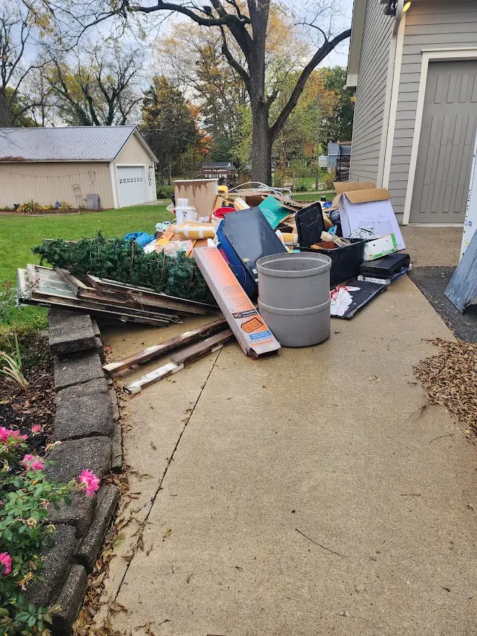 Dumpster being loaded with debris for Residential Dumpster Rental in Mountain View